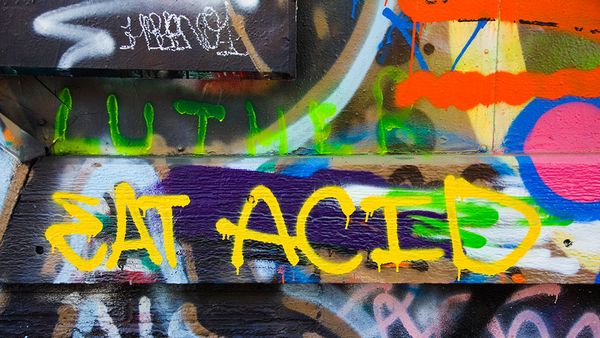 Vibrant graffiti decorates urban outdoors.