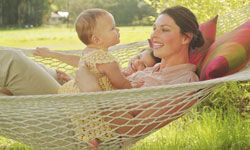 Mother in hammock with children